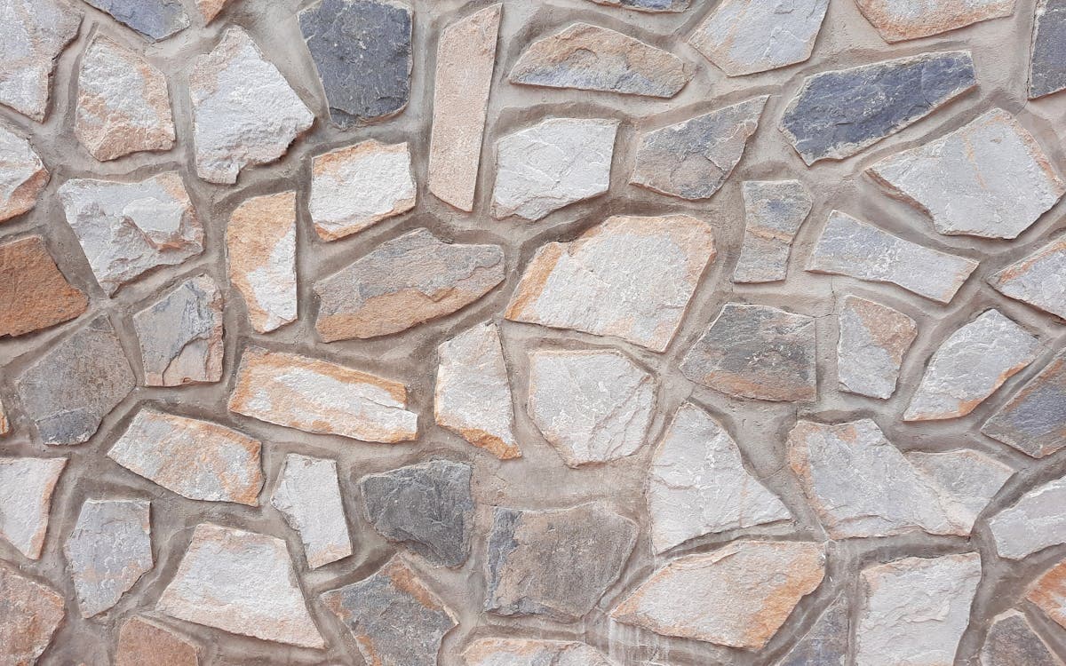 Reinforced retaining wall and site masonry